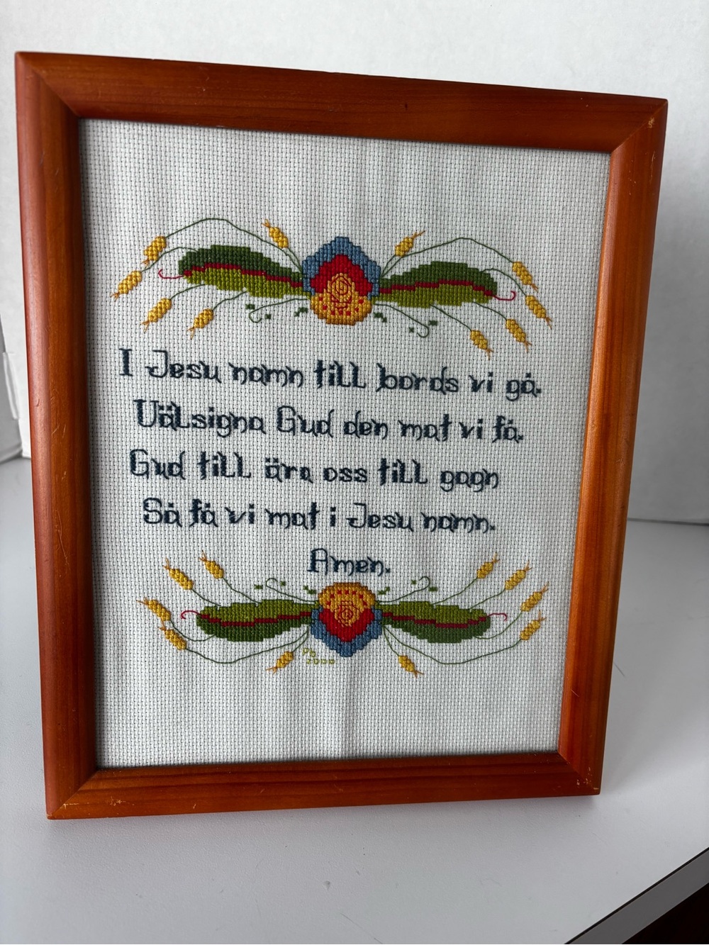 A traditional Swedish table prayer (bordsbön) cross-stitched and framed